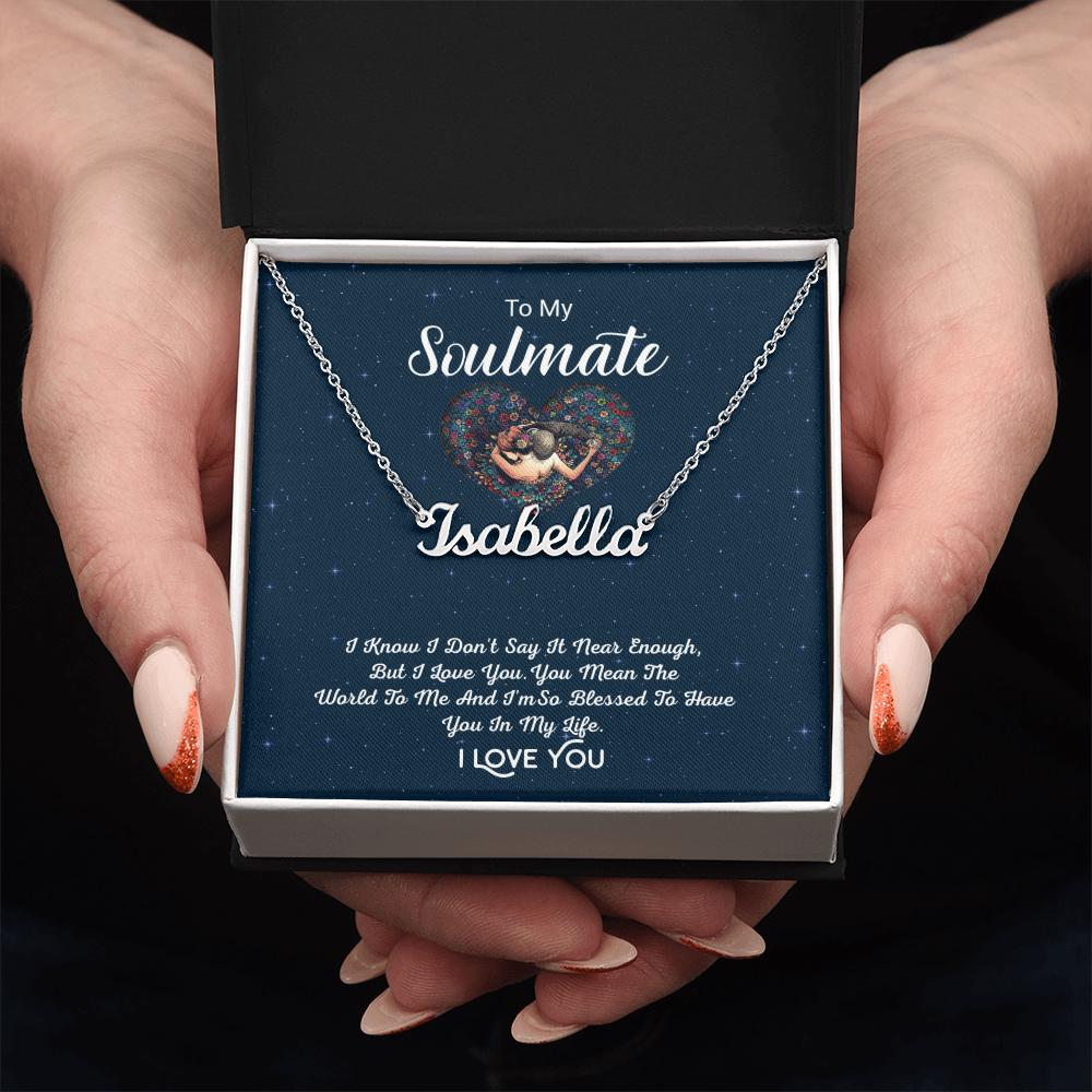 Hands holding the To My Soulmate personalized name necklace in a white gift box, polished stainless steel finish