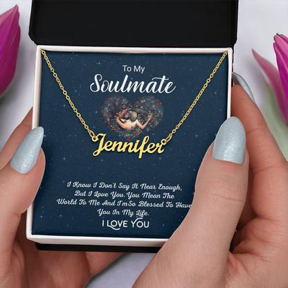 Hands with tulips holding the To My Soulmate personalized gold name necklace keepsake card